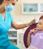 Dental Hygienist helping a patient.