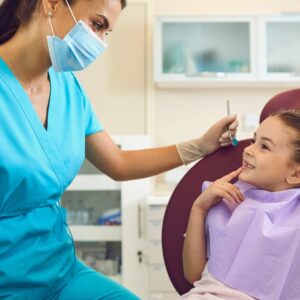 Dental Hygienist helping a patient.