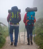 People hiking in the fog