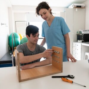 An occupational therapist working with a patient