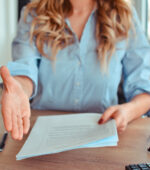 A woman extending her hand for a handshake