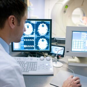 MRI technologist conducting a scan