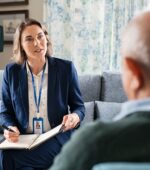 Social worker questioning a patient